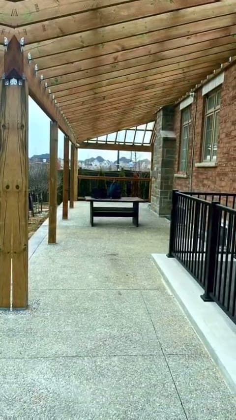 Covered walkway and railing — Global Construction Homes job site